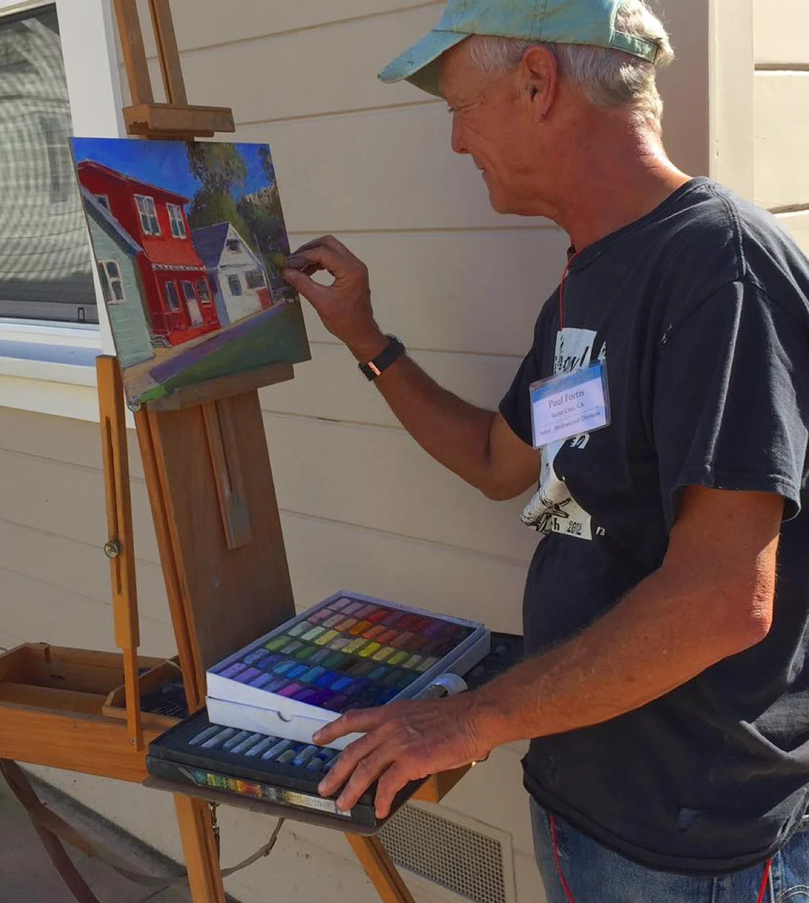 Paul Fortis working at an easel with soft pastels